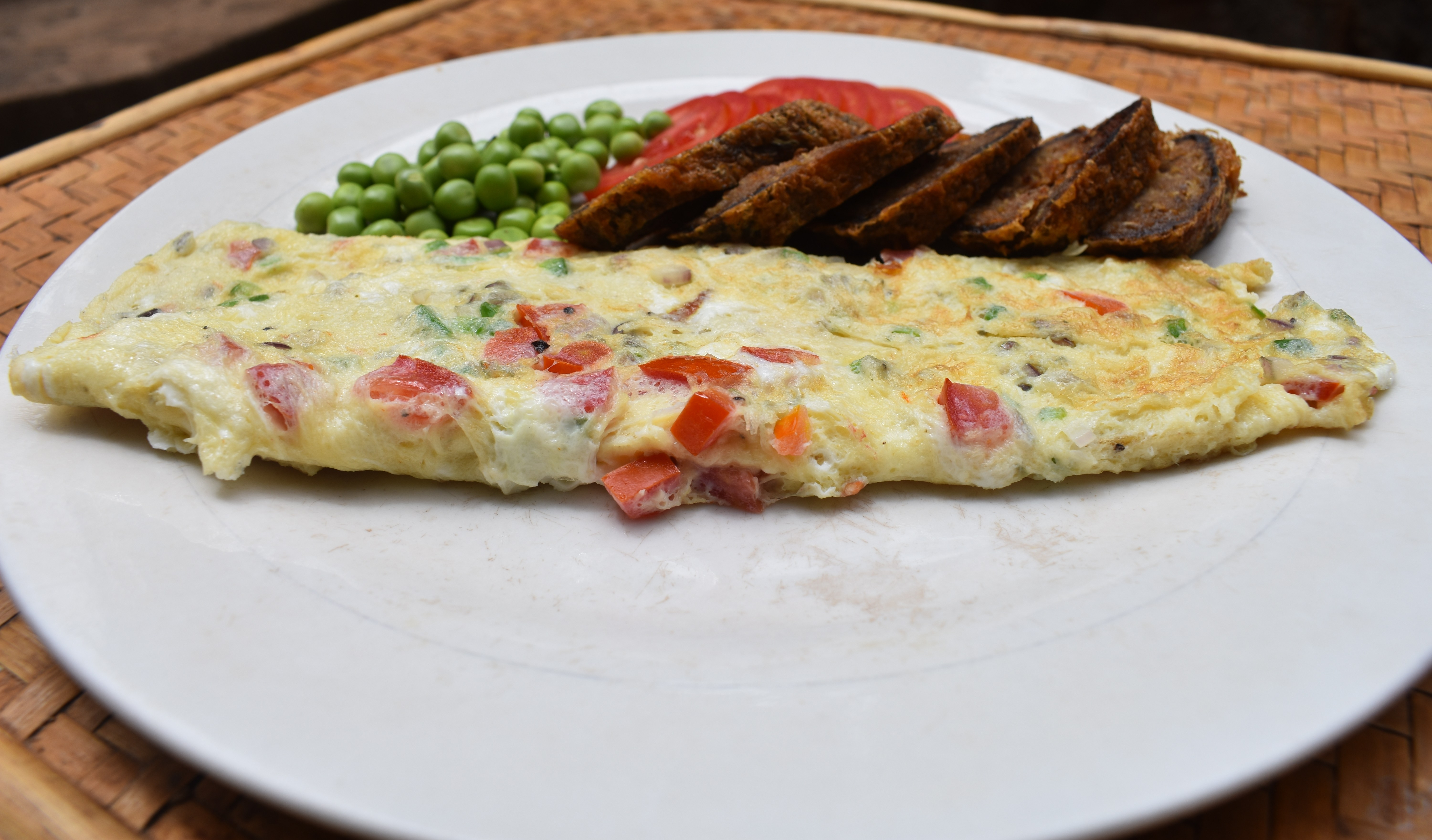 spanish omelette , peas and beef with egg